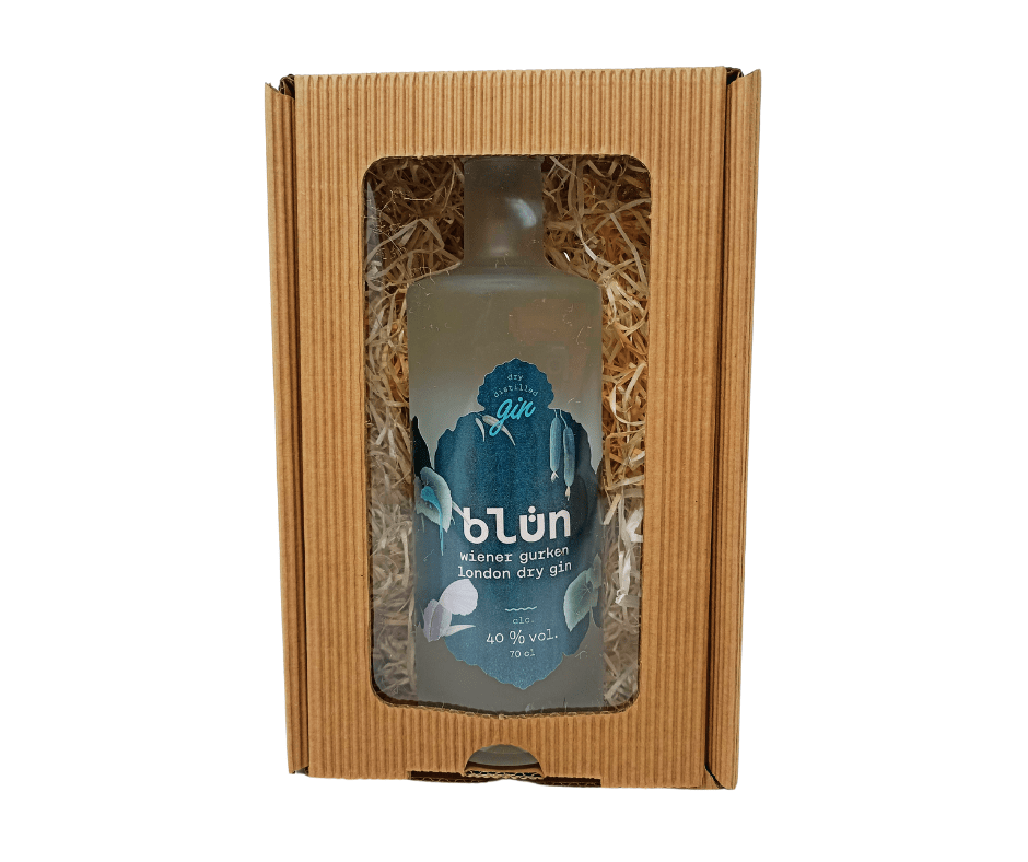 Bottle of Blüh Wiener Gurken London Dry Gin 700ml with blue label in a brown cardboard gift box with clear window and straw.
