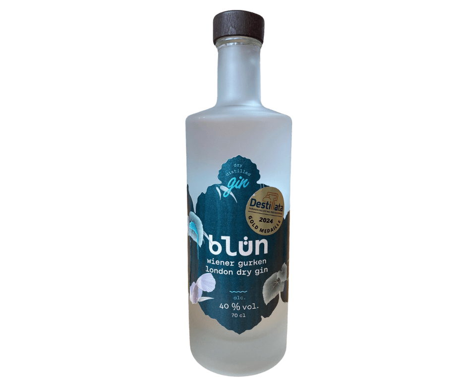 Frosted glass bottle of Blün London dry gin with black cap and dark floral label featuring gold award sticker.