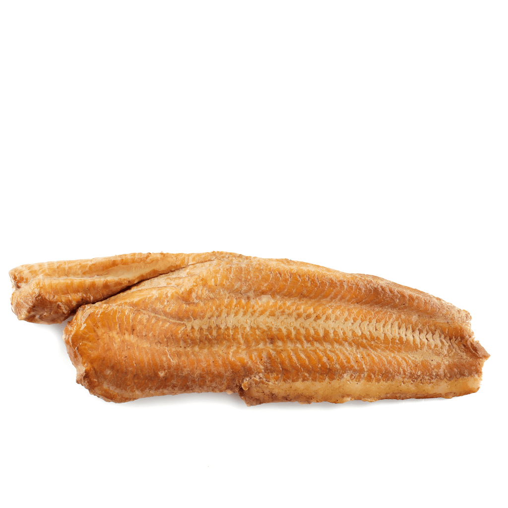 Smoked golden-brown wiener wels fish filet with textured surface on white background.